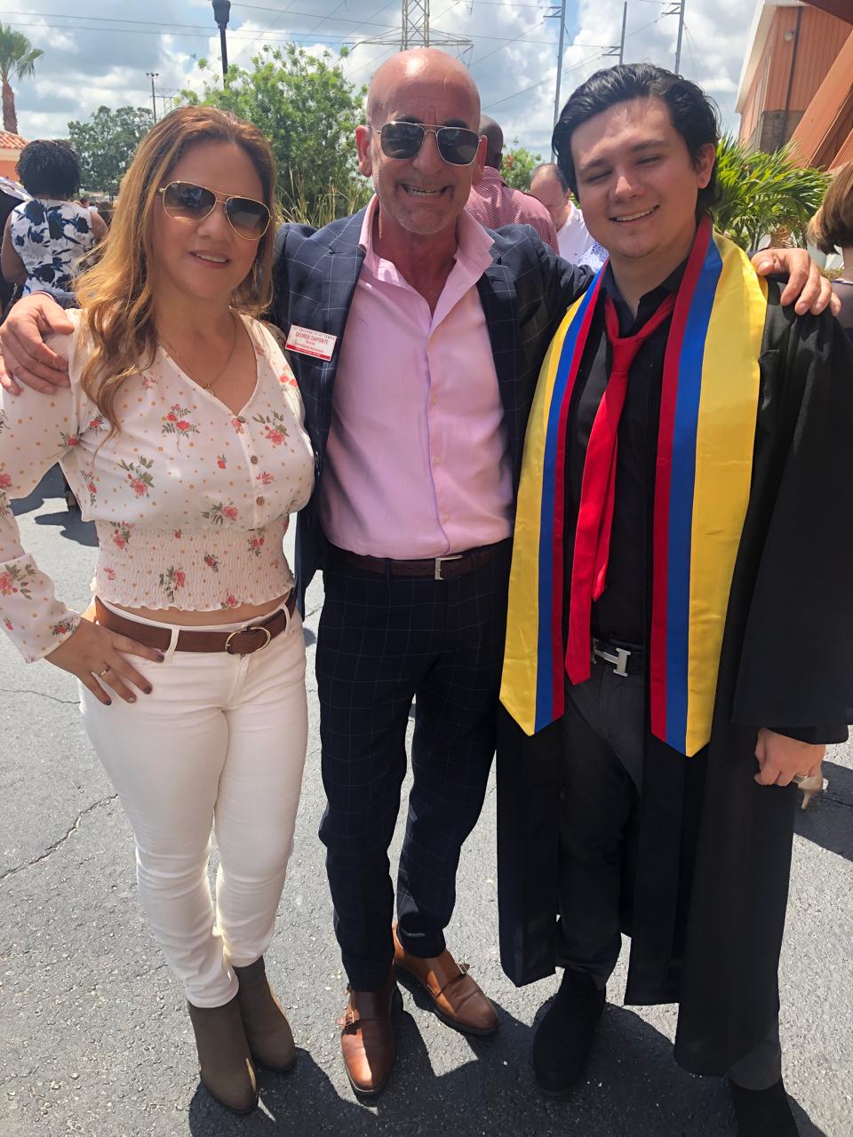 Sebastian graduating with honors from the University of Tampa's Sykes College of Business, 2019